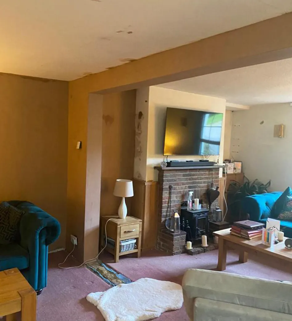 A living room filled with furniture and a flat screen tv.