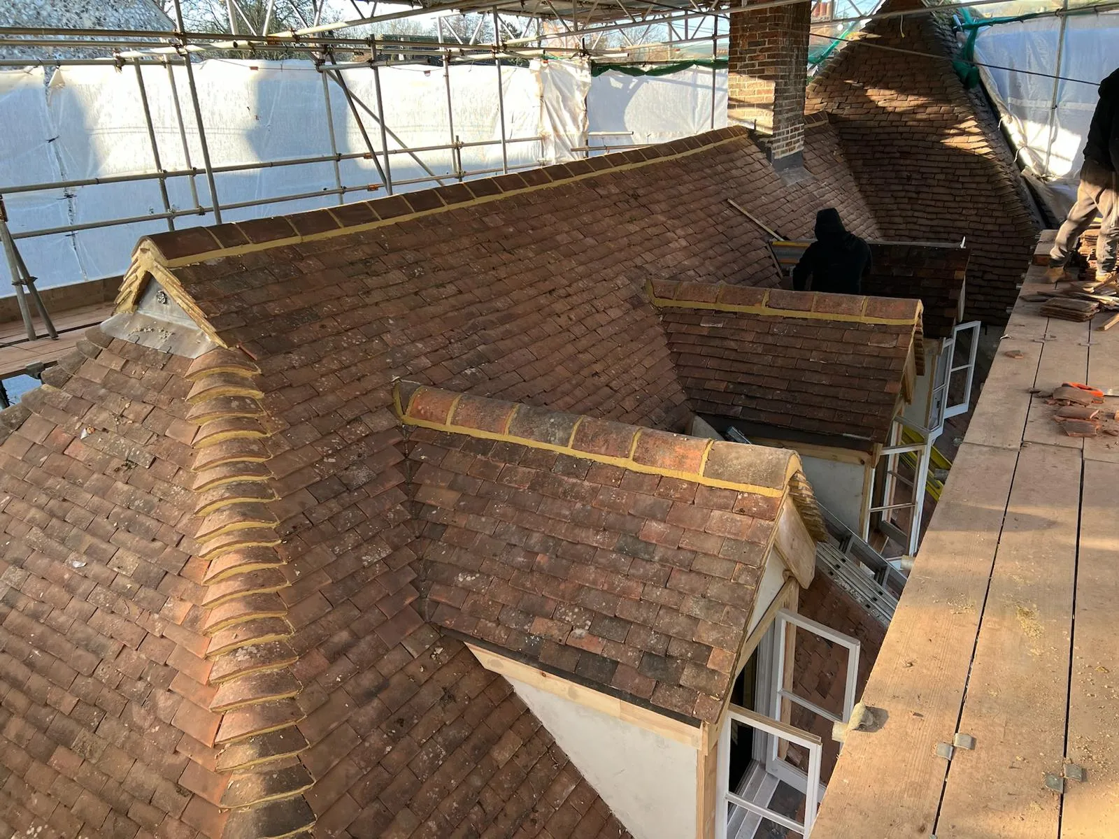 A view of a roof of a house under construction.