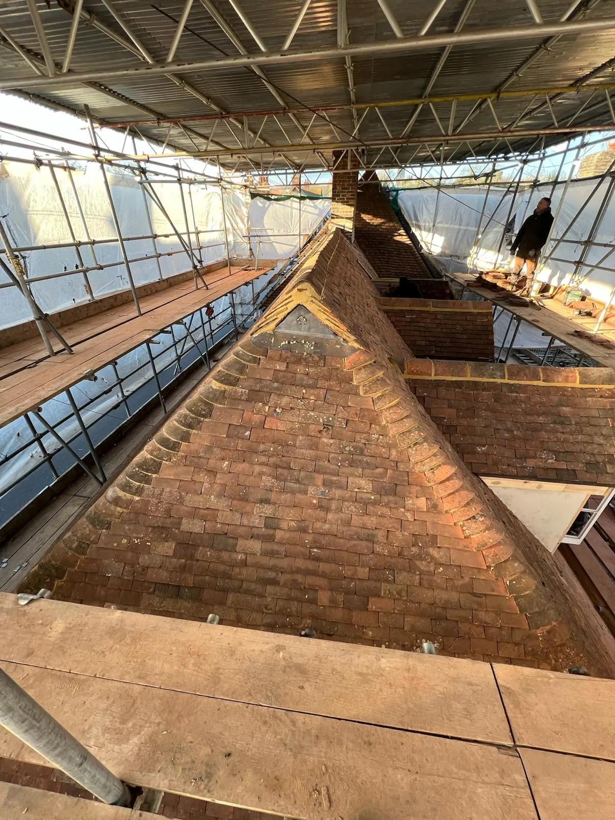 A very tall building with a very tall roof.