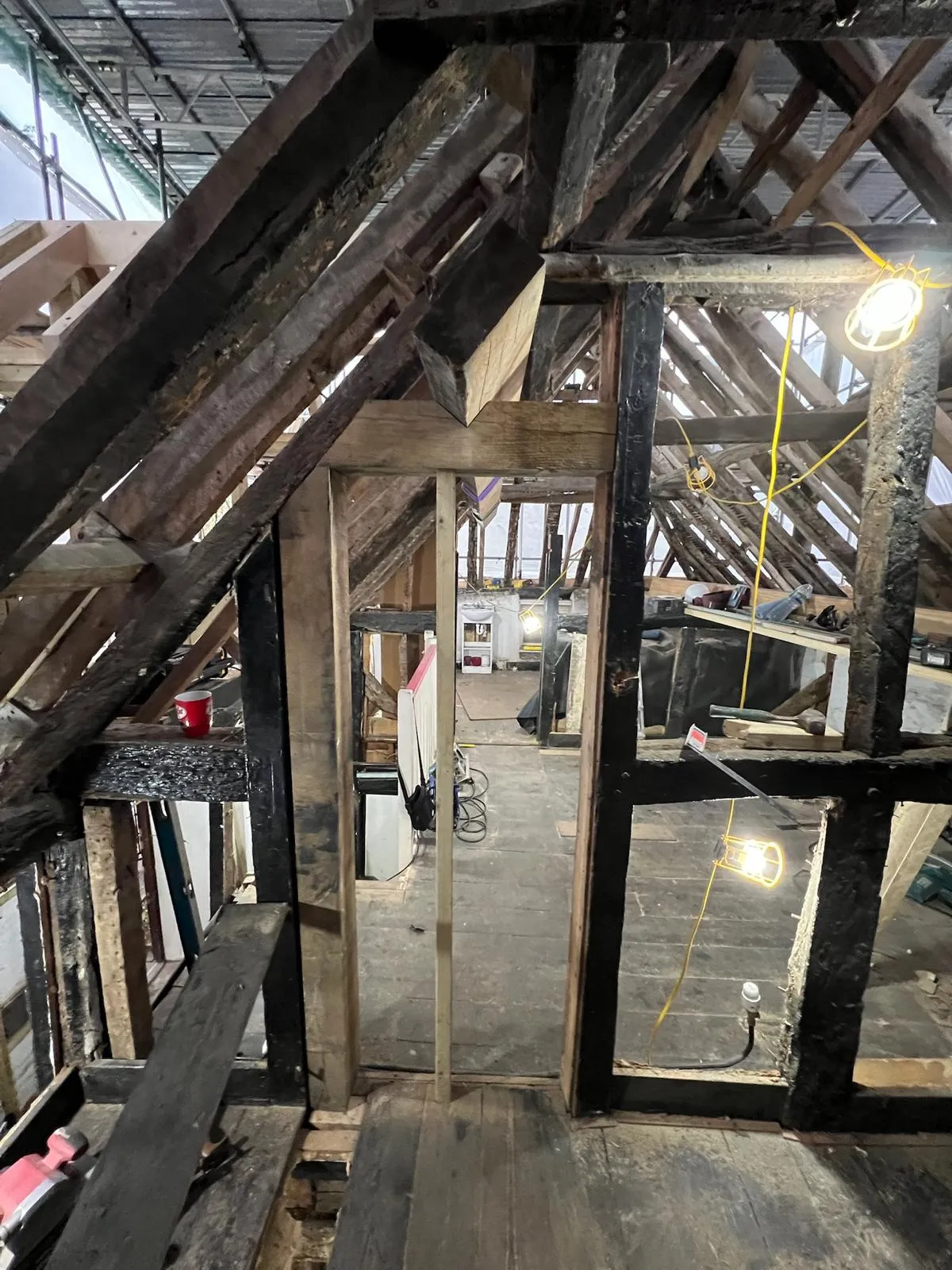 A room with a wooden floor and a window.