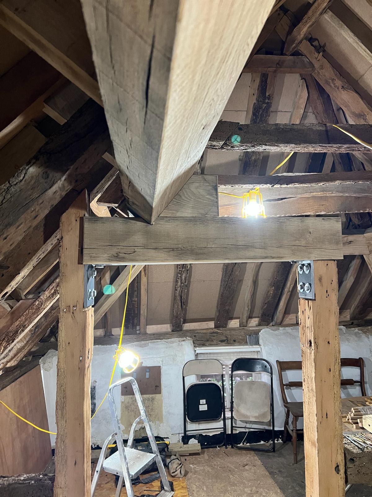 A room with a lot of wooden beams in it.