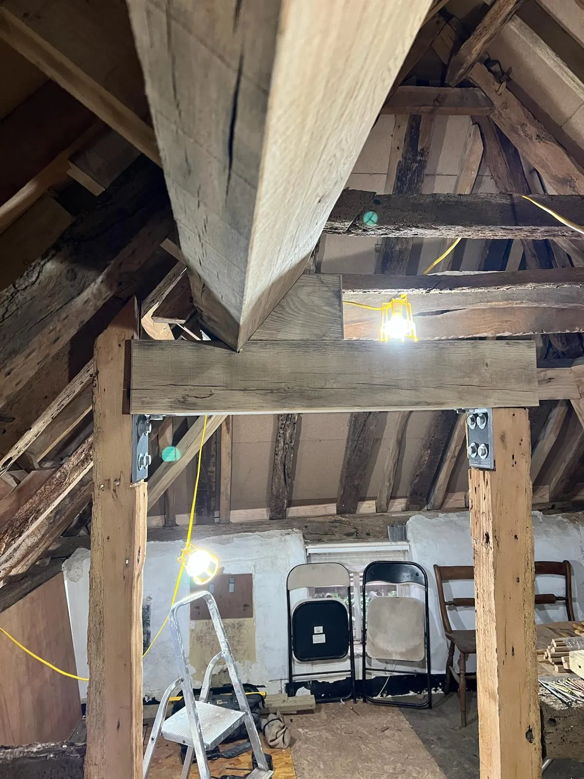 A room with a lot of wooden beams in it.