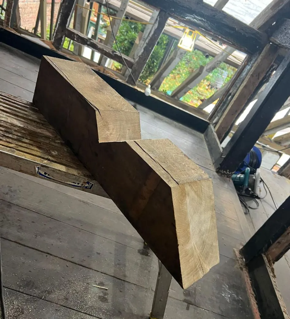 A wooden bench sitting on top of a wooden floor.